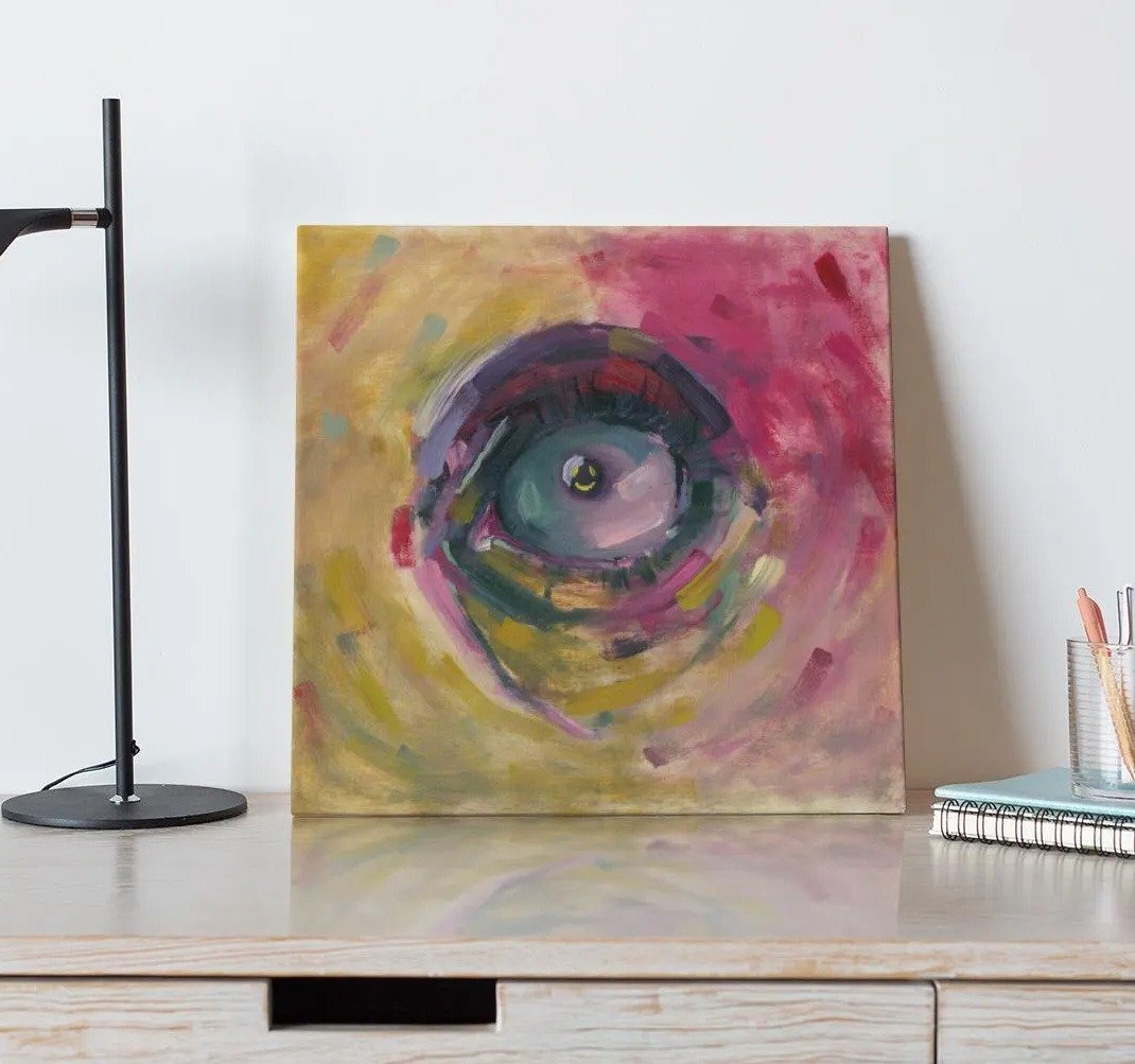 Be Happy, an original oil painting by Devon Regular, being displayed on a table.