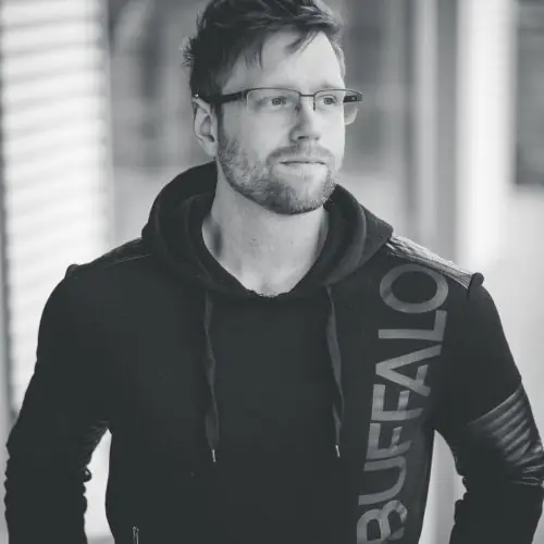 Image of the artist Devon Regular standing front on